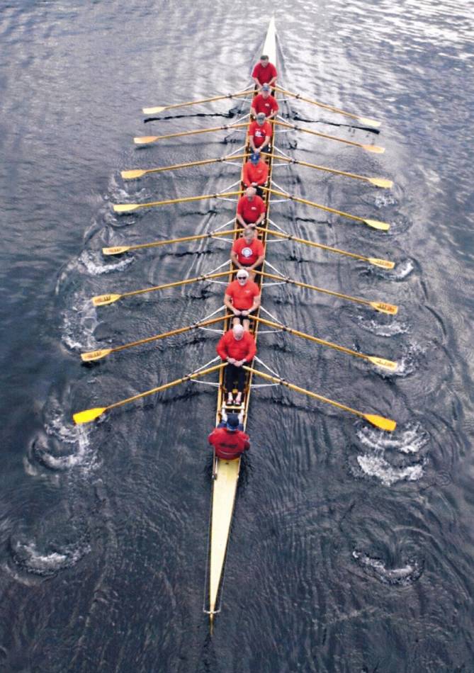 HOME - Ancient Mariners in Oct - picture in paper cropped Carrying on the family tradition. John W. Lundin, in seat 7, in an octet, a rowing shell set up for sculling with two oars per rower rather than sweep rowing with one oar. Lake Union, Seattle, Washington.